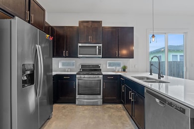 Kitchen featuring appliances with stainless steel