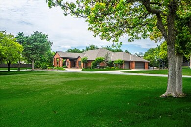 FRONT OF HOME HAS A VAULTED PORTECO CHERE AND CIRCLE DRIVE WITH 3 CAR SIDE ENTRY GARAGE