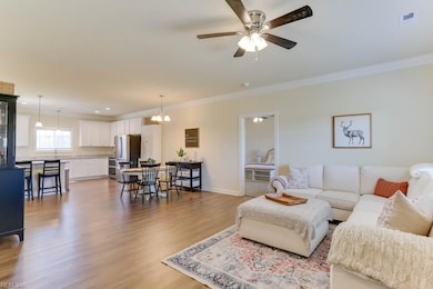 Open design family room flows into the dining area that overlooks the spacious kitchen