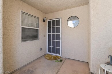 View of exterior entry featuring stucco siding