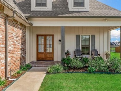 Doorway to property with a yard