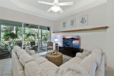 Living area featuring a ceiling fan, sliders to la