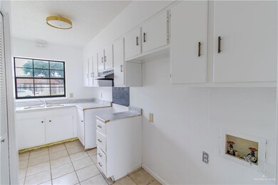 Kitchen featuring new laminate counter tops and double sink.
