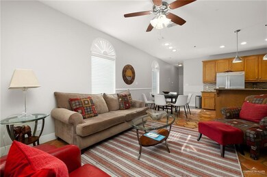 Tiled living room featuring ceiling fan