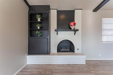 Unfurnished living room with hardwood / wood-style