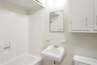 Bathroom with toilet, a sink, and bathing tub / sh