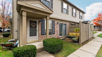 Entrance to property featuring brick siding