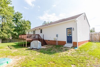 REAR EXTERIOR W/ 12X10 DECK, SMALL PAVED GRILL PAT