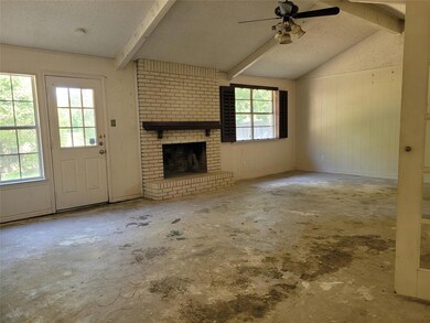 Unfurnished living room with ceiling fan, vaulted 