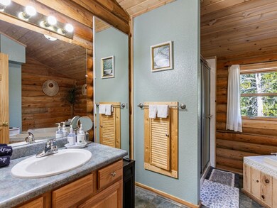 Bathroom featuring vaulted ceiling, independent sh