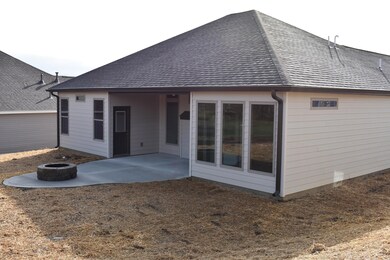 partially covered patio w/ firepit