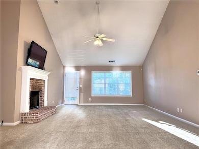 Unfurnished living room featuring carpet, a ceilin