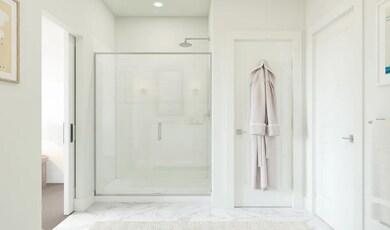 Primary bath with glass shower enclosure