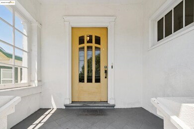 Entrance to property featuring stucco siding