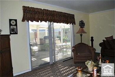 Another view of living room, towards back yard