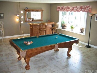This living space is ideal as a game room with a f