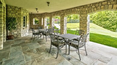 Walkout Gameroom Covered Bluestone Patio open to a