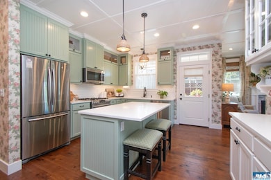 Beautifully appointed kitchen featuring handcrafted cabinets and granite countertops.
