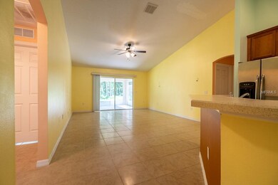 Main living area. Kitchen at right, bedrooms #2 and #3 at left. Master bedroom far right.