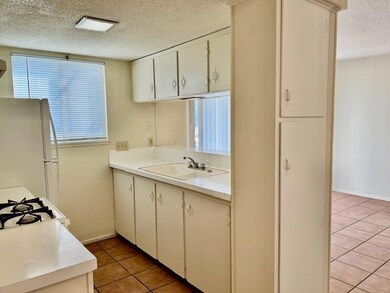 Kitchen featuring light tile patterned flooring, 