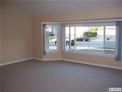 Living Room with scraped vaulted ceiling and wall 