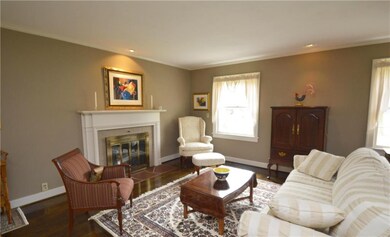 Lots of light in this formal living room with fire