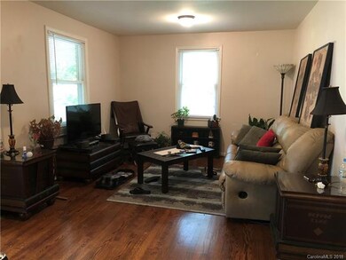 2nd view of family room. Nice wood floors