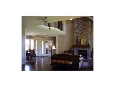 Stone fireplace is lovely focal point in great roo