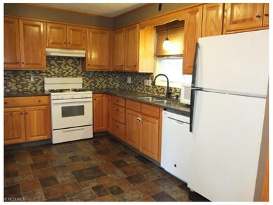 Kitchen has a pantry and comes applianced with dis
