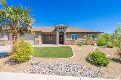 Prairie-style home featuring stone siding, a tile roof, and stucco siding