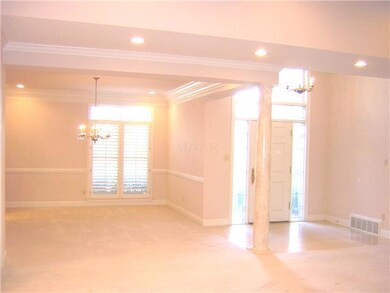 This view of the dining room and entryway was take