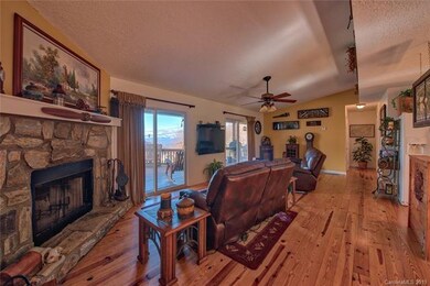 Enjoy Your Long Range View and the Wood Burning Fireplace from Your Luxurious Leather Sofas!