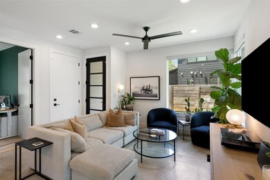 Living room featuring ceiling fan, recessed light