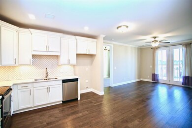 Condo #303 offers open floor plan, wood floors, la