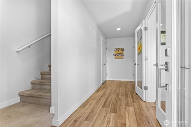 Main entrance with access to lower level .bed with half bath, storage, and garage.