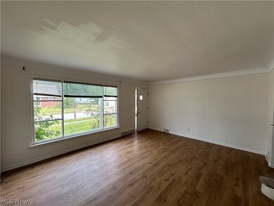 Unfurnished room with hardwood / wood-style floors