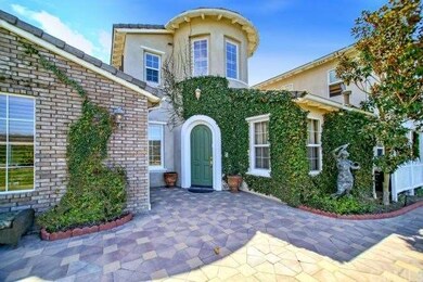 Welcoming front courtyard features great views