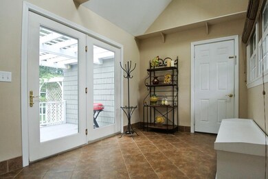 Convenient tiled mudroom, with...