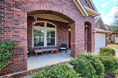 View of exterior entry featuring brick siding and