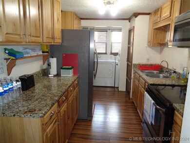 Kitchen has granite countertops and stainless appl