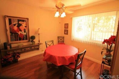 Dining room with ceiling fan and window overlookin