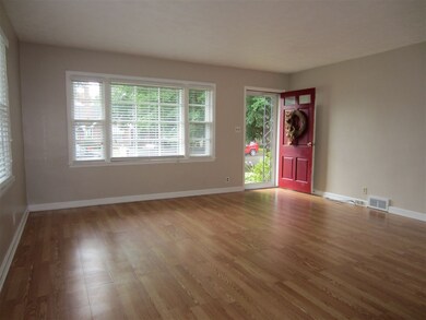Spacious Living Room with newer wood laminate floo