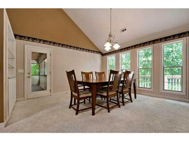 Dining Room. Built-ins are easy to access with glass shelves and accent lighting.