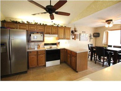 Kitchen with updated tiled floors that expand to t
