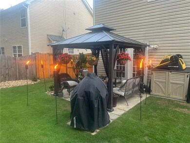 View of patio featuring a gazebo and grilling area