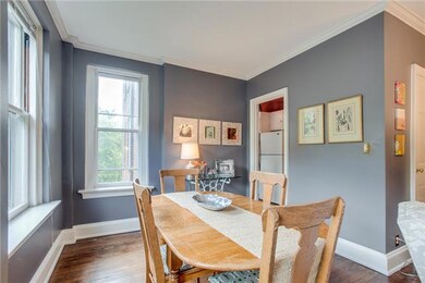 Dining area situated between kitchen and living room.