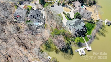 Property is located on a short cove, perfect for swimming and fishing, with quick access to open water for boating and water sports