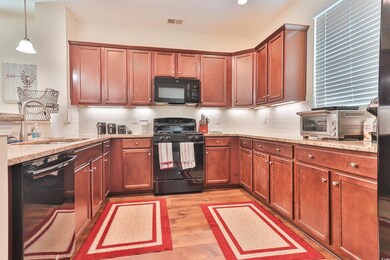 Kitchen with light hardwood / wood-style flooring,