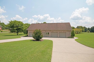 Parking for Guests?  No problem.  A 4 car side entry garage that is wide enough for everyone to pul straight in and out and still circle our.  Your company has plenty of room for family get togethers or parties. 