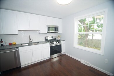 New kitchen featuring engineered hardwood flooring